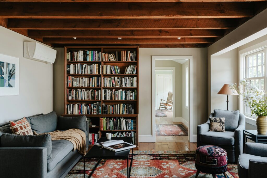 A room with a library & AC unit