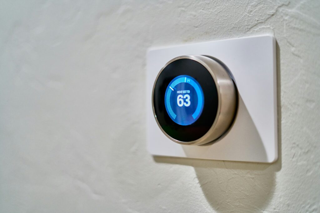 Programmable thermostat on wall