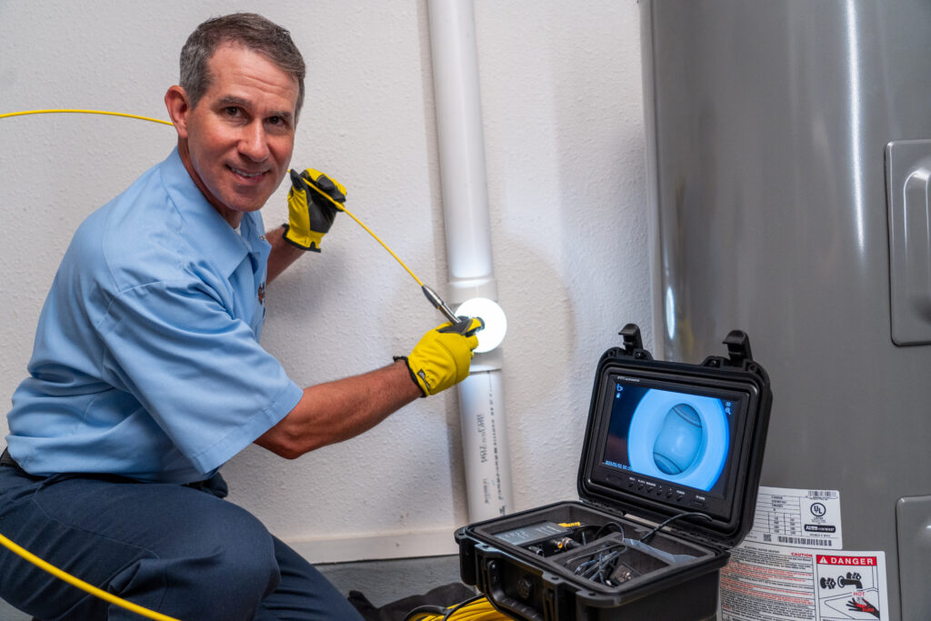 Plumber Working on Hot Water Heater