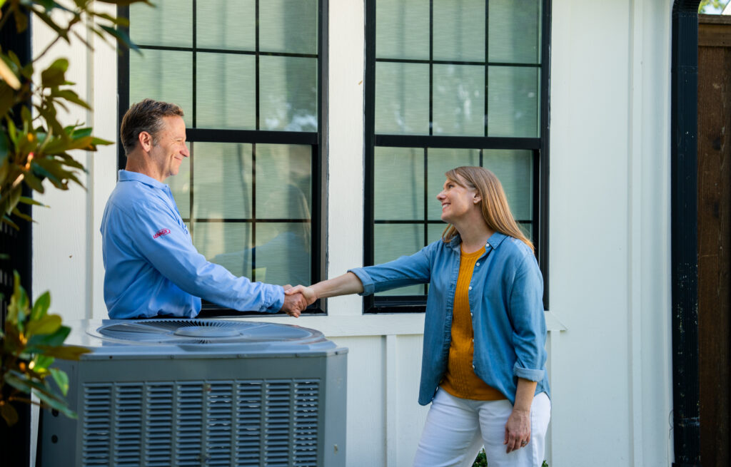 Arctic Air AC Tech shaking client's hand