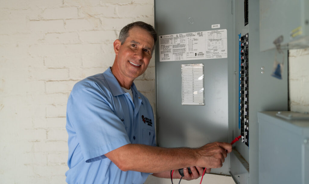 HVAC Tech Fixing a Circuit Panel