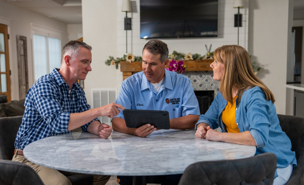 HVAC Technician Discussing Options with Clients