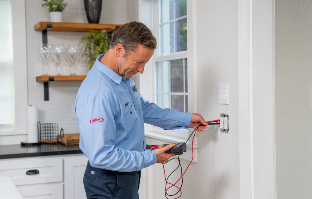 Arctic Air Electrical Technician Checking Kitchen Wiring