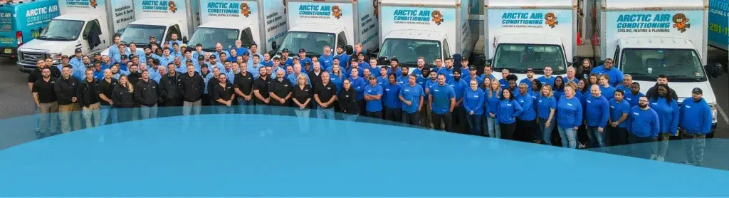 Arctic Air Team Member Lined Up in Front of Arctic Air Vans