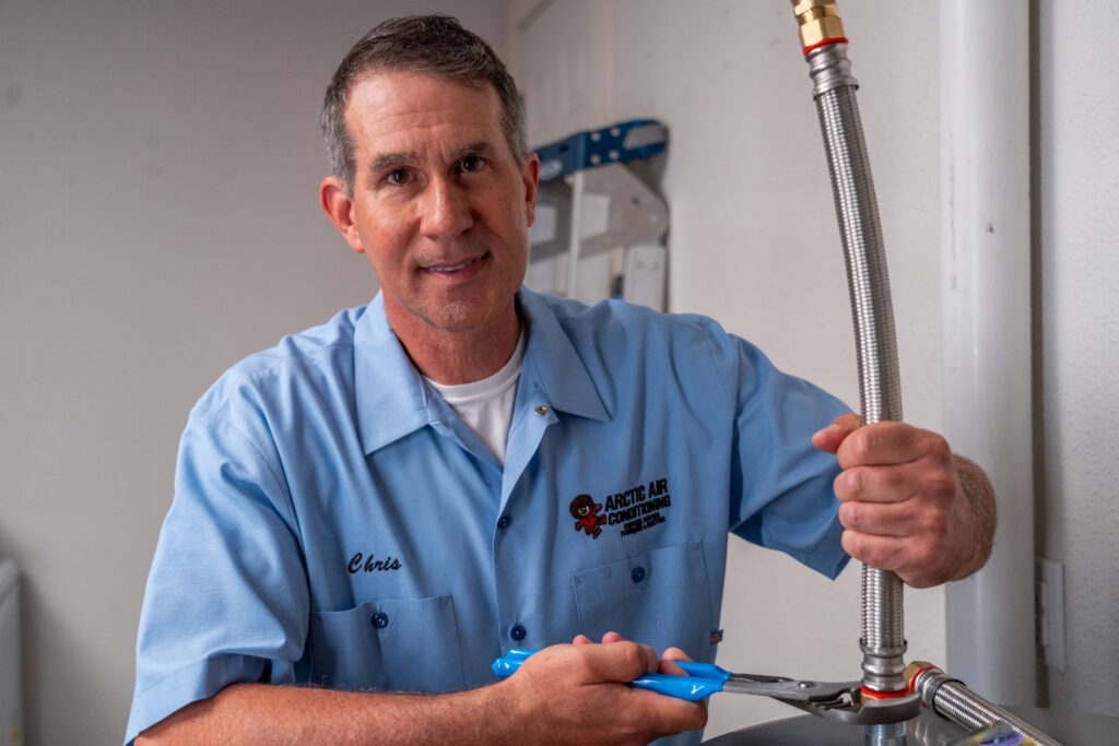 Arctic Air Plumber Installing a Water Heater