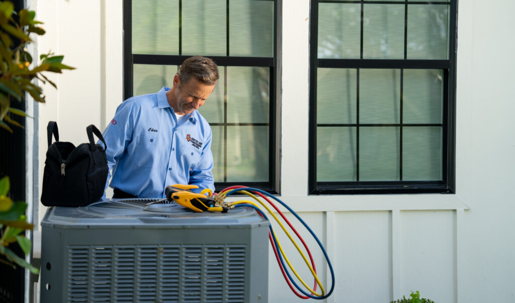 Arctic Air AC Tech Working on a System