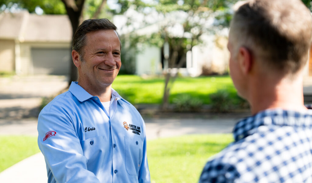 Arctic Air HVAC Technician Smiling at Customer