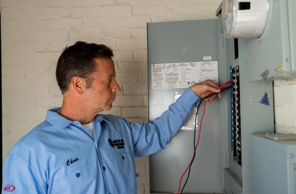 electrician working on electrical panel